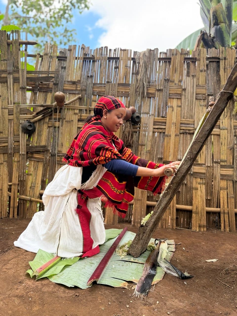 Visitor experiencing traditional kocho making in Dorze